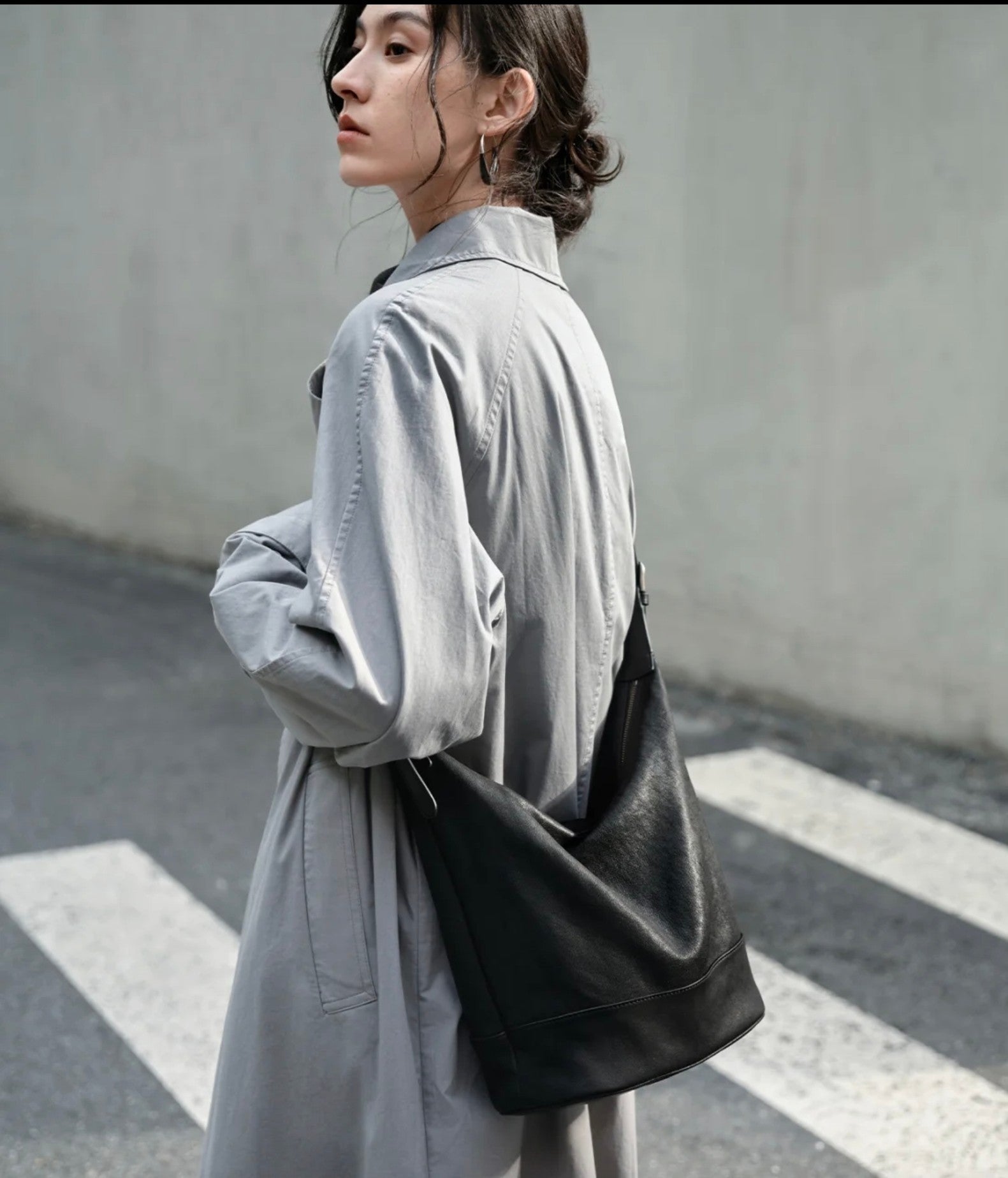 The Noir Voyage Convertible Leather Bucket Bag 