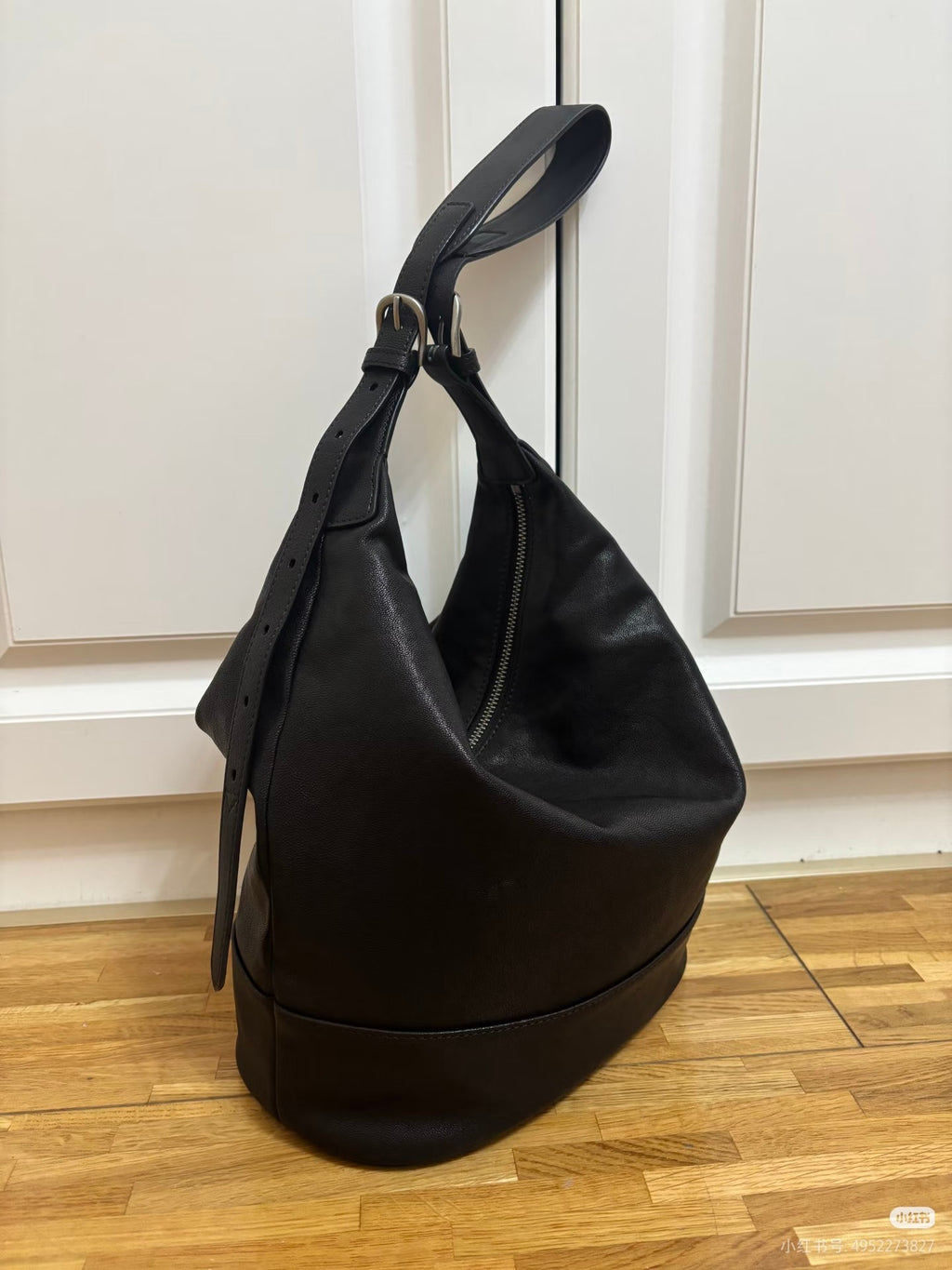 The Noir Voyage Convertible Leather Bucket Bag 