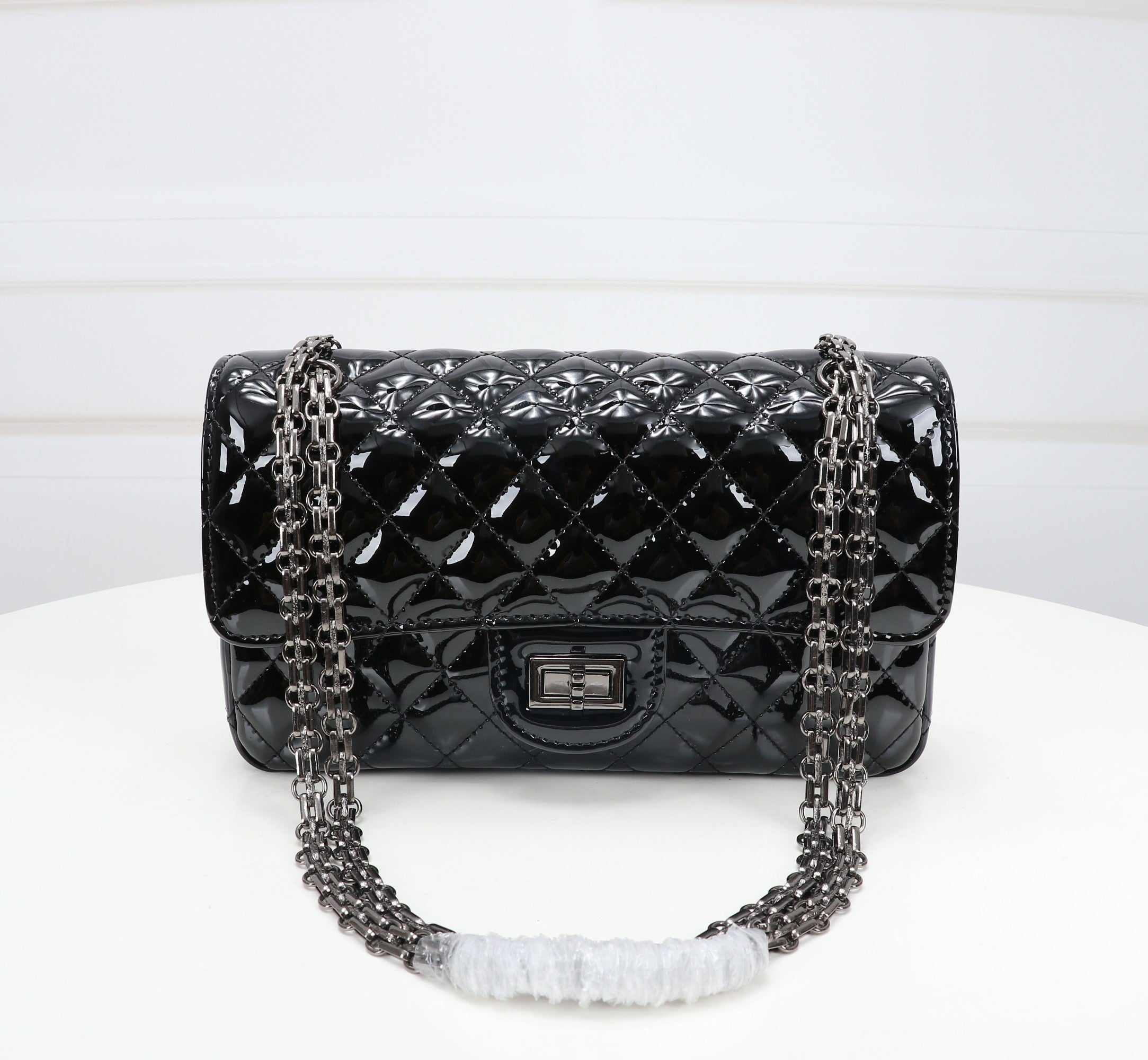 The Noir Lumière Patent Flap Bag